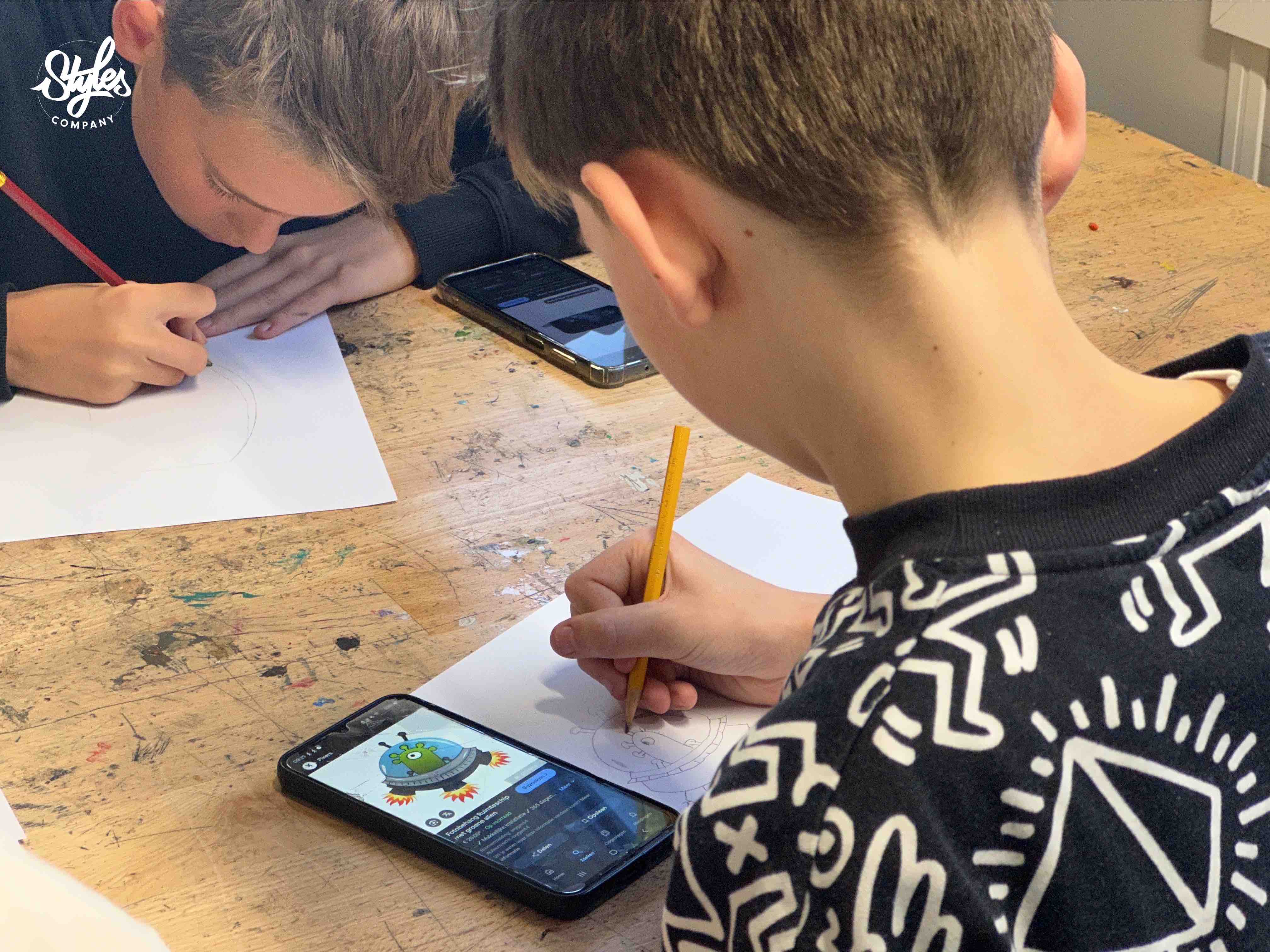 Leerling oefent tijdens een Character Design workshop van STYLES Company